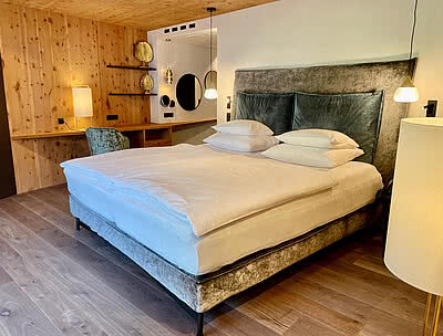 Bett in der Wellnesssuite Deluxe im STOCK resort