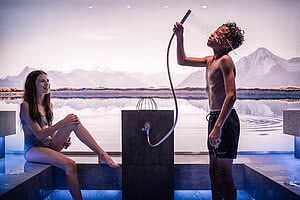 Two children in the steam bath in the family wellness hotel STOCK resort Austria