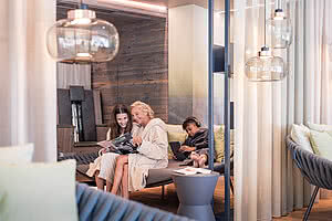 Grandma and granddaughter in the Family Spa relaxation room in a 5 star wellness hotel Austria STOCK resort