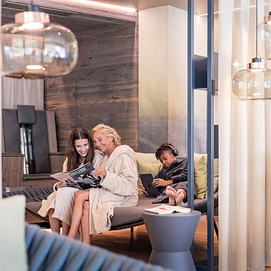 Grandma and granddaughter in the Family Spa relaxation room in a 5 star wellness hotel Austria STOCK resort