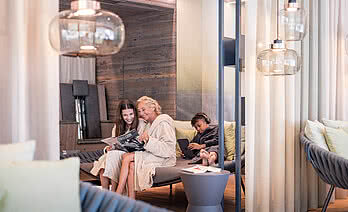 Grandma and granddaughter in the Family Spa relaxation room in a 5 star wellness hotel Austria STOCK resort