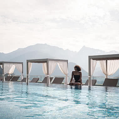 Woman at pool in 5-Star Wellness Hotel STOCK resort Austria