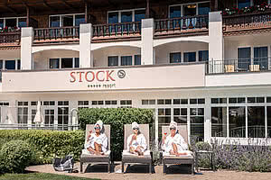 Three ladies relaxing on loungers in the 5 star wellness hotel STOCK resort Austria