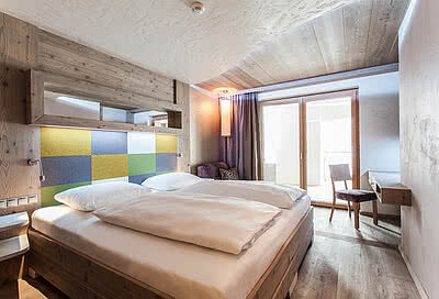 Schlafzimmer in der Alpin Lodge II im STOCK resort