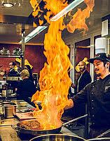 Man cooking for Kitchenparty in gourmet hotel STOCK resort in Austria