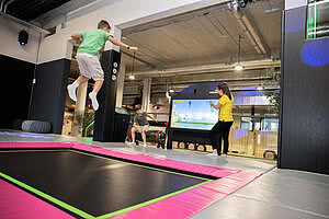 Children jumping on a trampoline in the Action Park in Tyrol STOCK resort