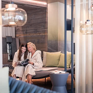 Grandma and granddaughter in the Family Spa relaxation room in a 5 star wellness hotel Austria STOCK resort