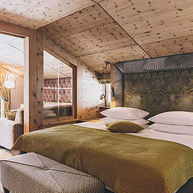 Bed in the Sonnblick Comfort double room in STOCK resort