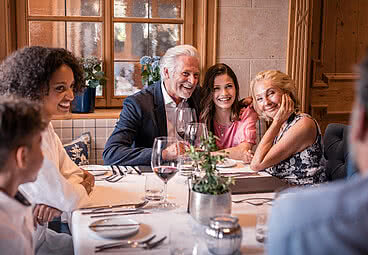 Family in restaurant in Gourmet Hotel Austria STOCK resort