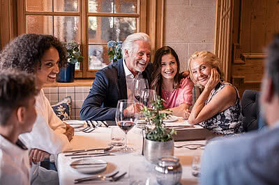 Family in restaurant in Gourmet Hotel Austria STOCK resort